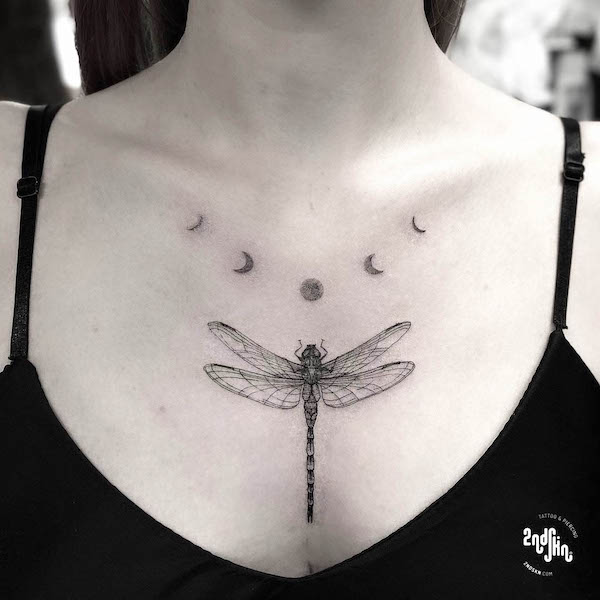 Dragonfly and moon phase chest tattoo by @2ndskintattoo