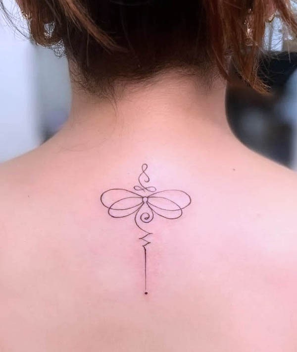 Symbolic dragonfly back tattoo by @pirate_jax