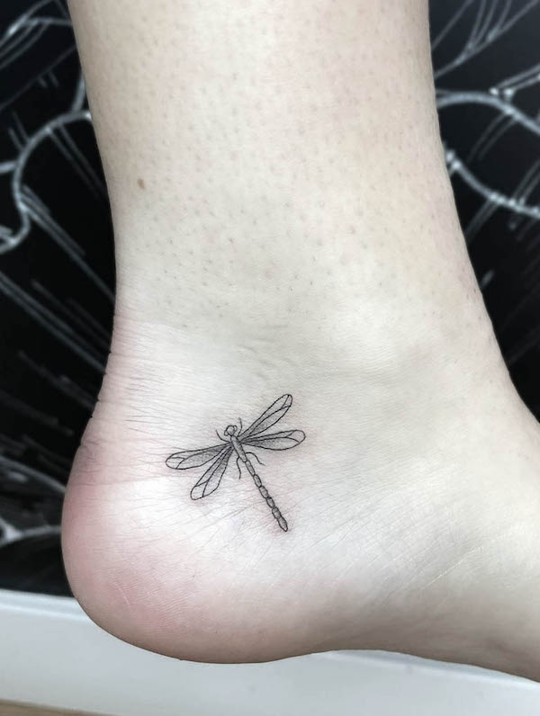 Tiny dragonfly ankle tattoo by @amazinkgraceartistry