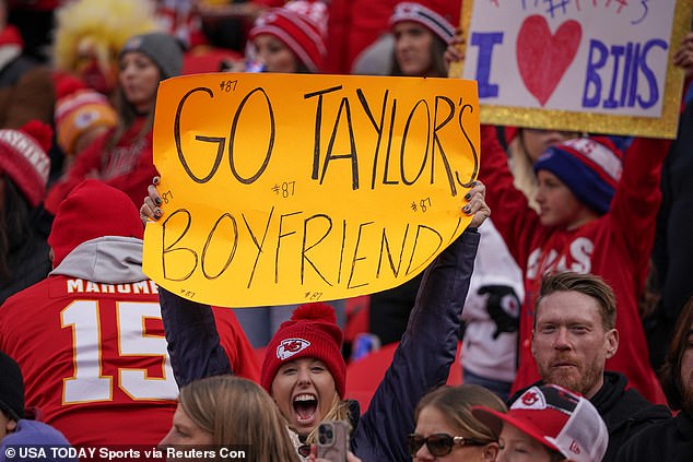 One fan held up a sign that read 'Go Taylor's boyfriend'
