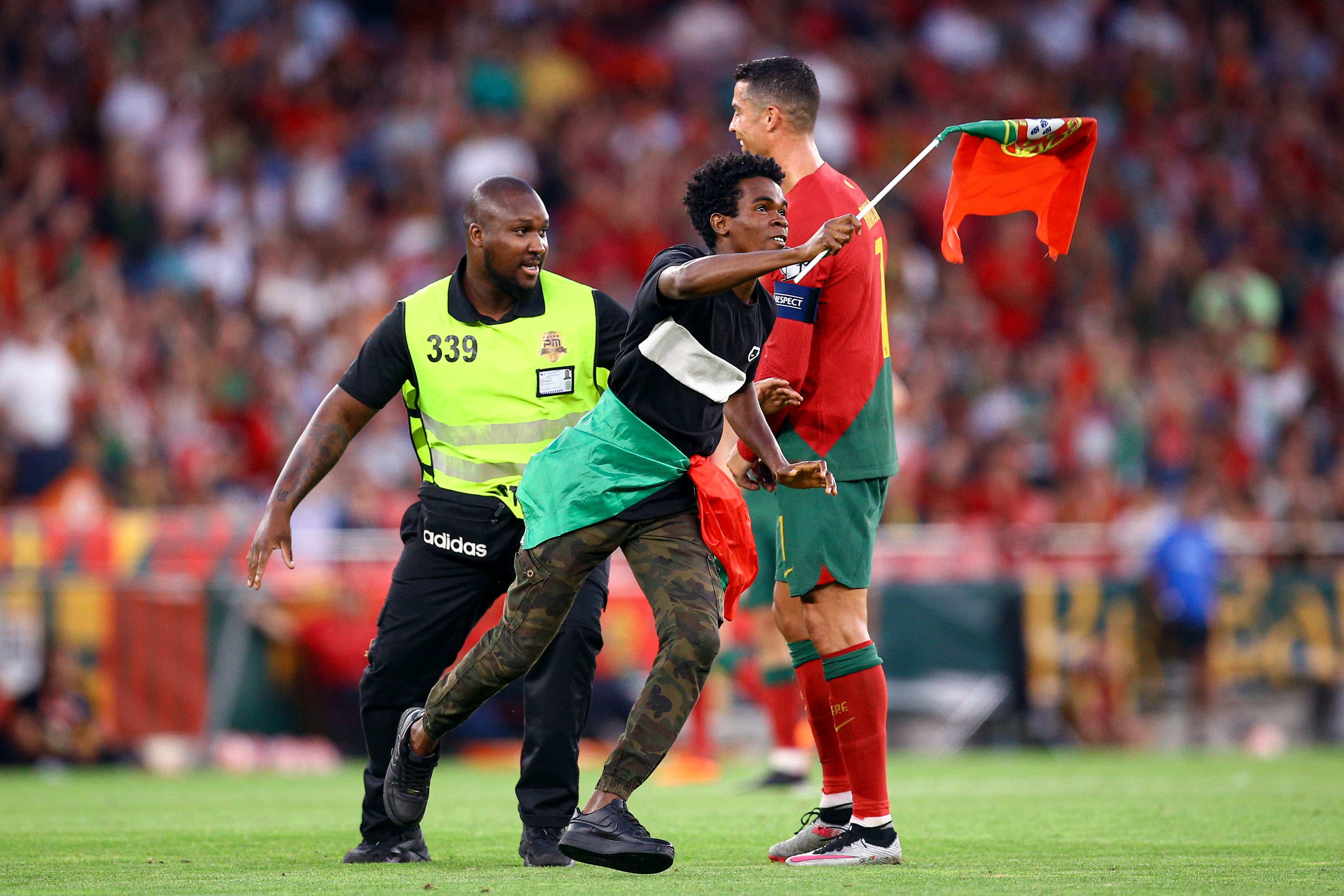 The Astonishing Moment When Ronaldo Was Lifted by a Pitch Intruder During Portugal's Euro Qualifier Against Bosnia 5