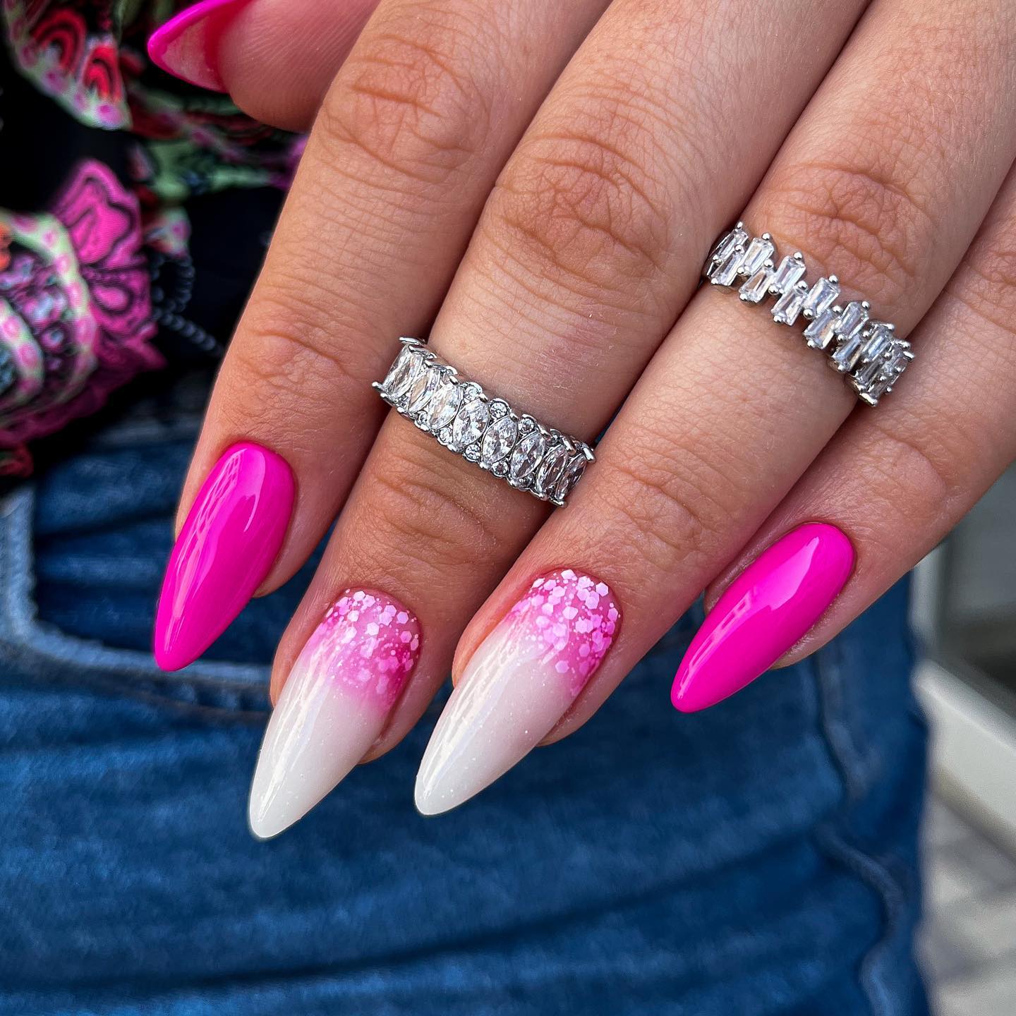 Oval pink nails and this type of nail art are for women who like to draw around and on top of their bold nails.