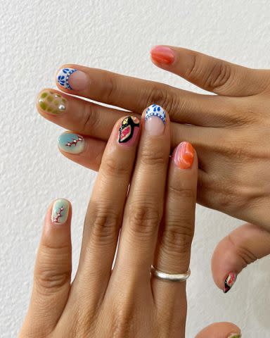 <p>Kesang Gurung Instagram</p> Mismatched nails by @kesangthenailartist.