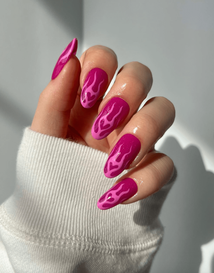 cute bright pink manicure with flaming heart designs