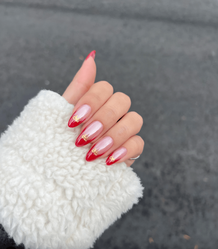cute red french tip Valentines Day nails with gold bow nail art