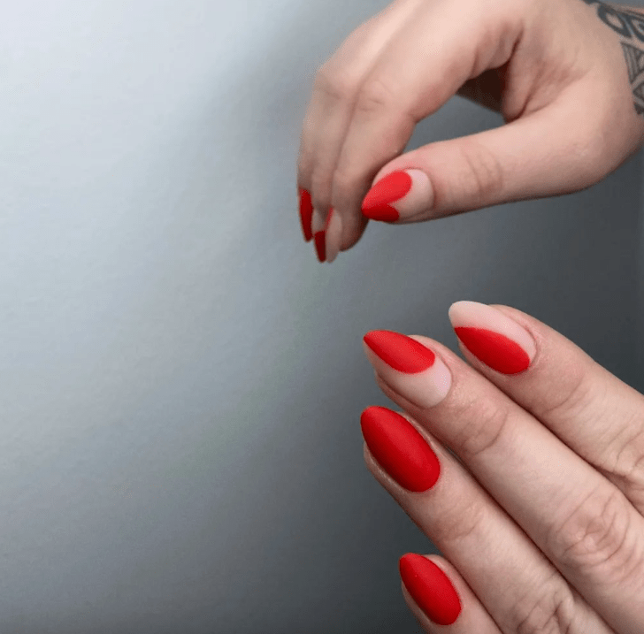 cute matte red Valentines Day nails with mismatched abstract negative space designs