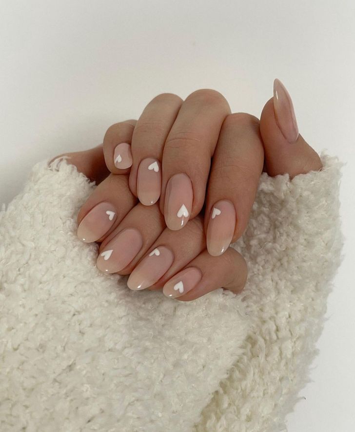cute nude simple Valentines Day nails with small white heart nail art designs