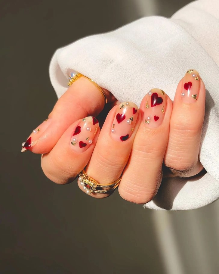 cute short Valentines Day nails with pearl and gold foil nail art decals and red heart designs