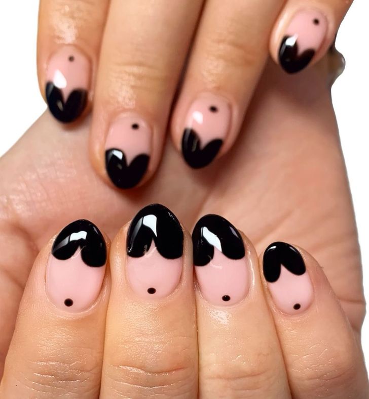 cute short black Valentines Day nails with heart shaped tip designs and dot nail art at the cuticle
