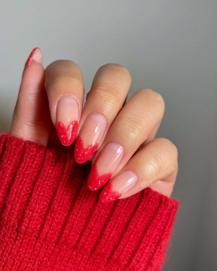 cute and simple Valentines Day nails with glitter red heart shaped tips