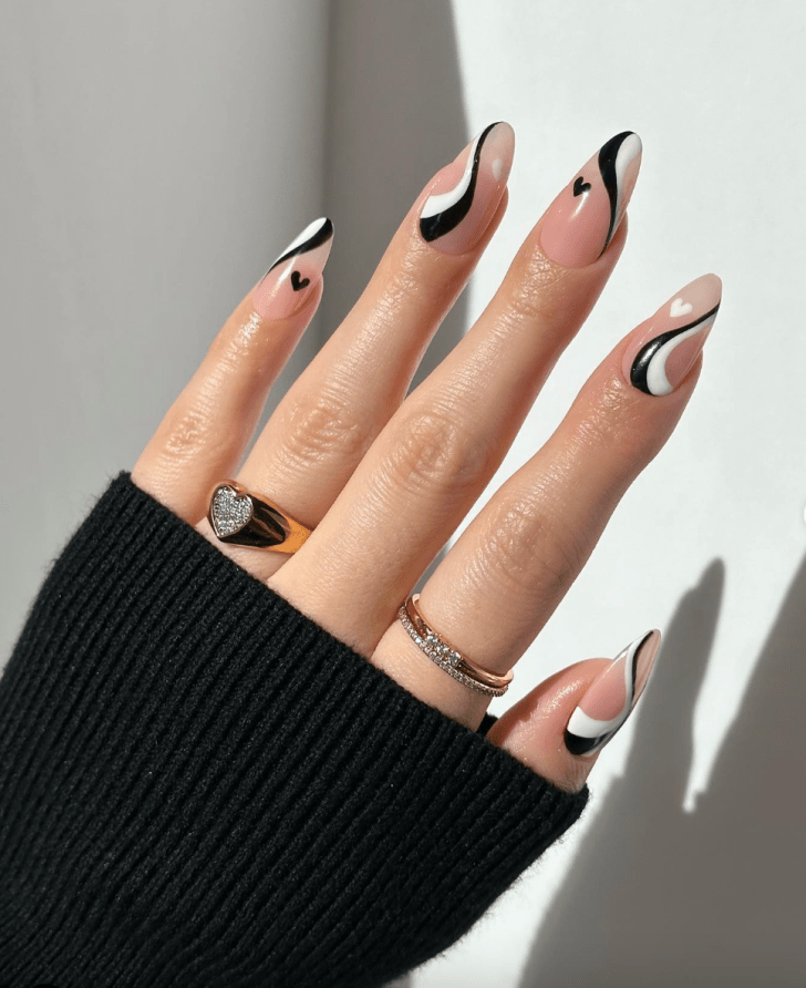 cute white and black manicure with wavy designs