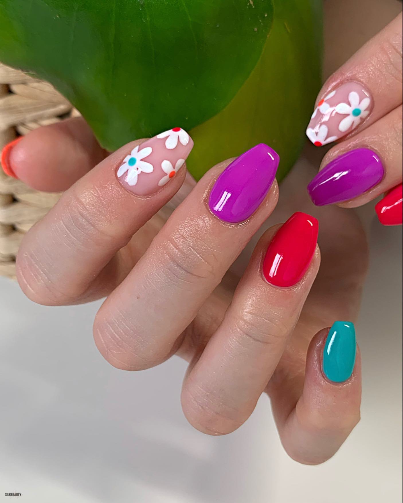 For those who likes colorful floral nail ideas will love these nails! Blue, pink and purple colors are so matching.