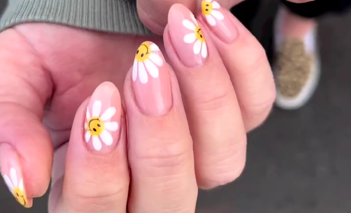 daisy smiley face nail design