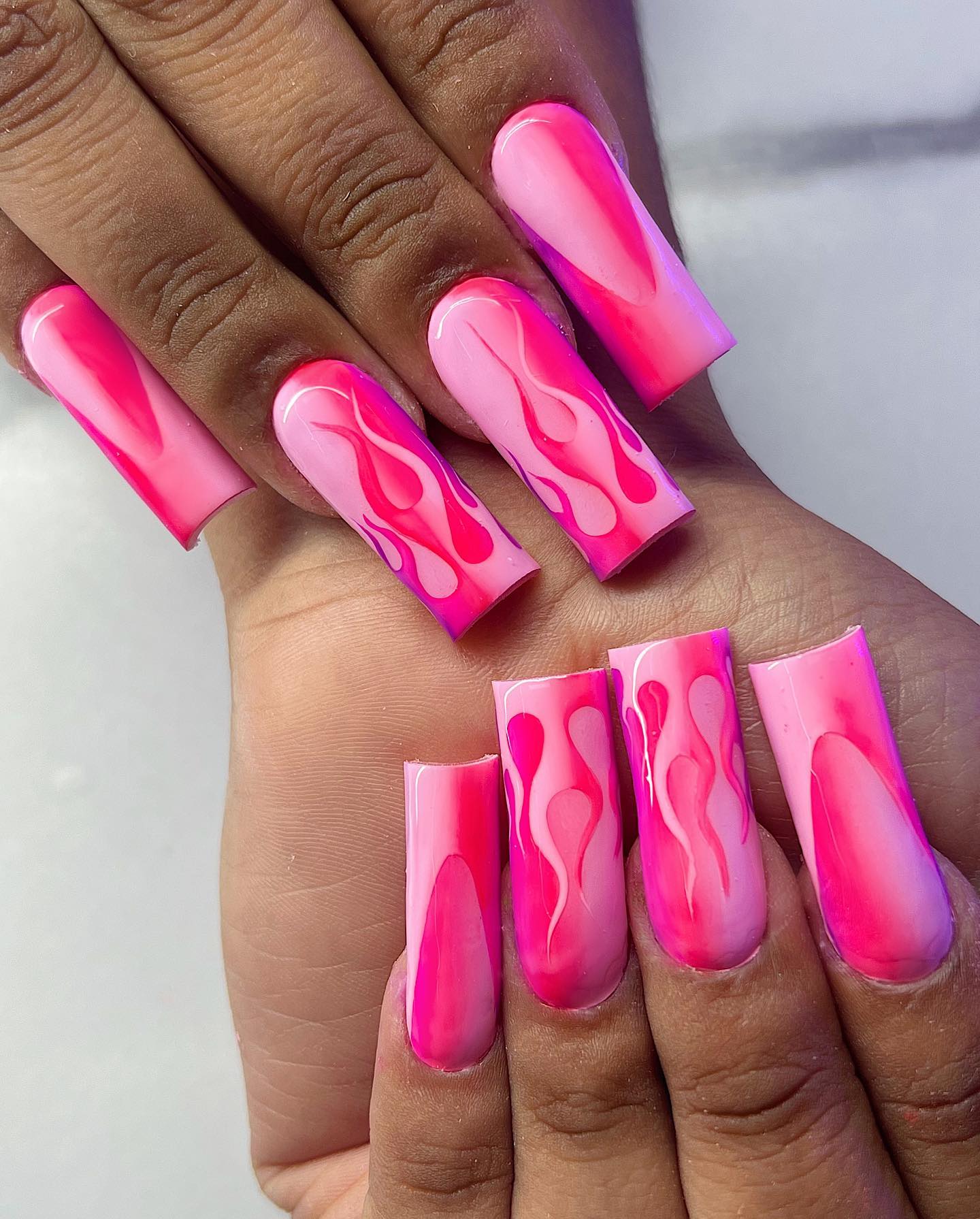 Just look at this piece of art above. It should be called a piece of art because of its perfect shading details with bright and dark pink color. When you add flames as accent nails, you are sure to look fabulous.