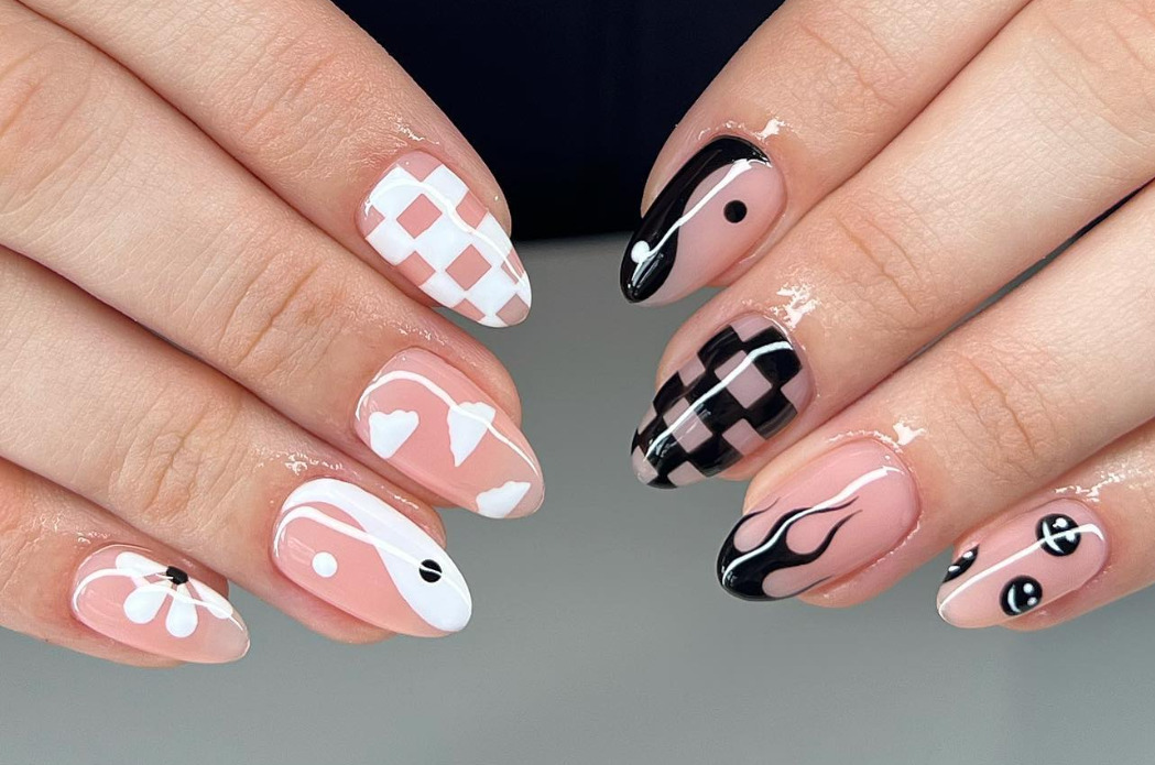 mix and match black and white smiley face nail design