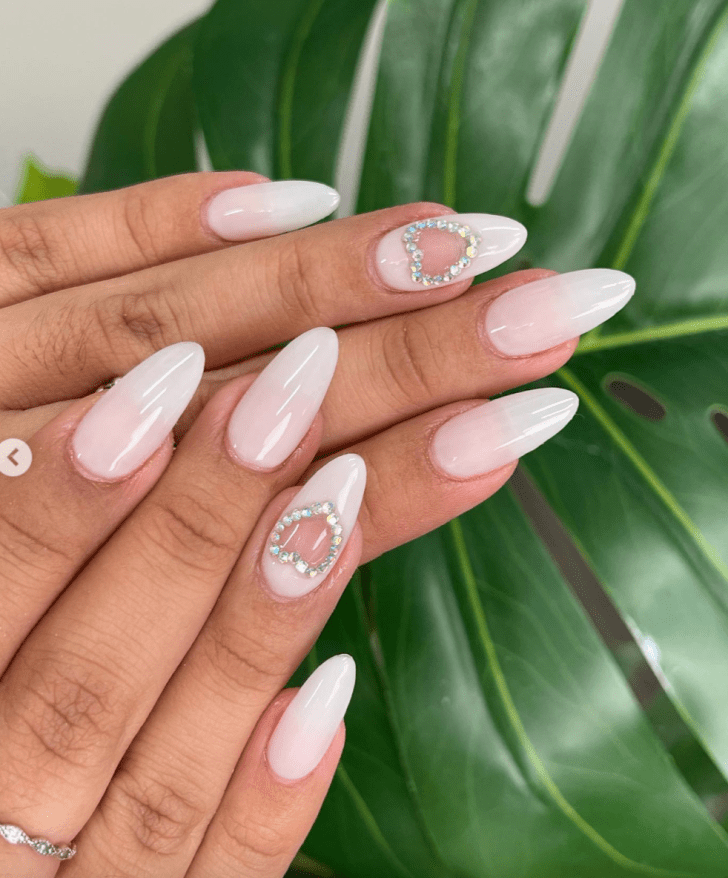 simple light pink Valentines Day nail ideas with rhinestone heart designs