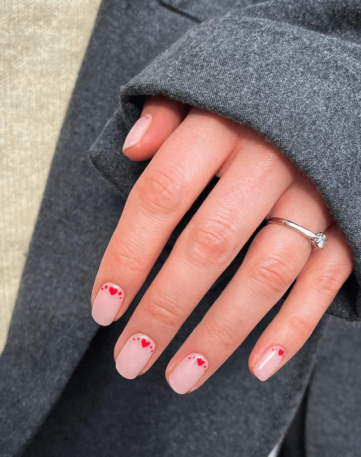 simple nude short Valentines Day nails with cute red heart and dotted cuticle nail art