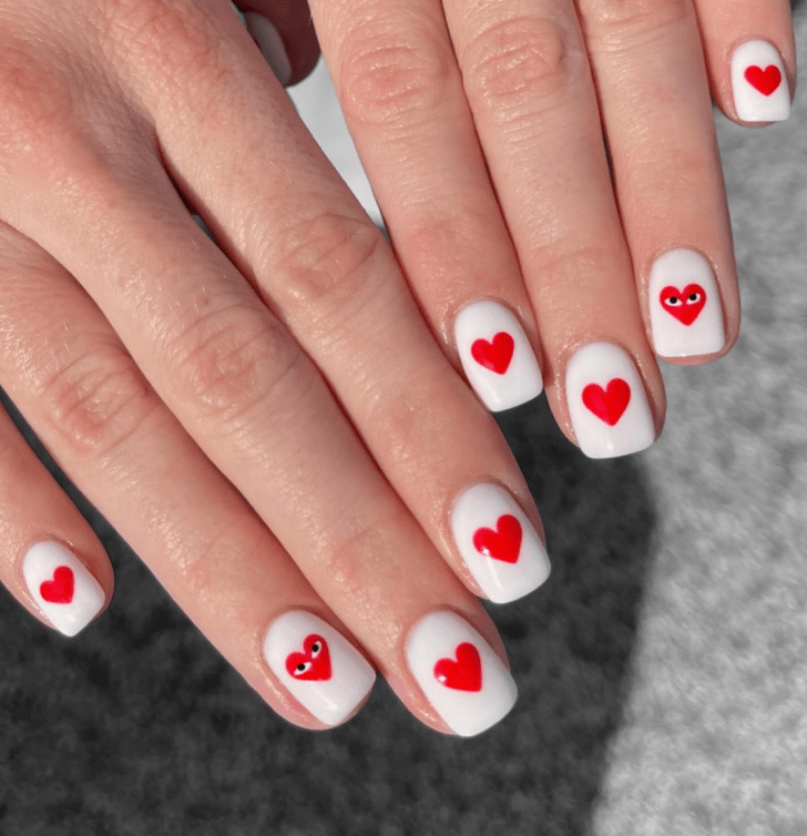 simple and short white Valentines nails with cute red heart nail art