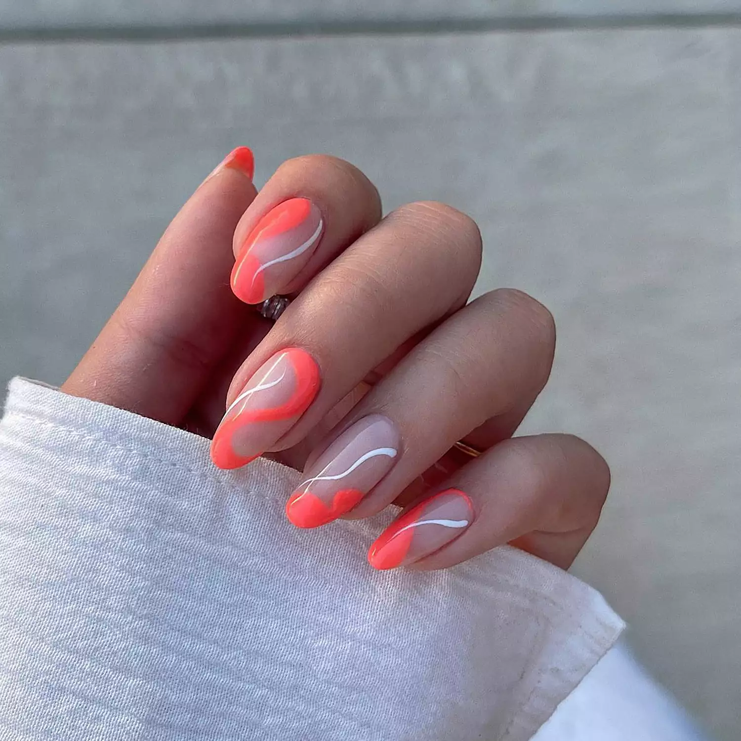 Negative space manicure with swirls in a hot hibiscus color