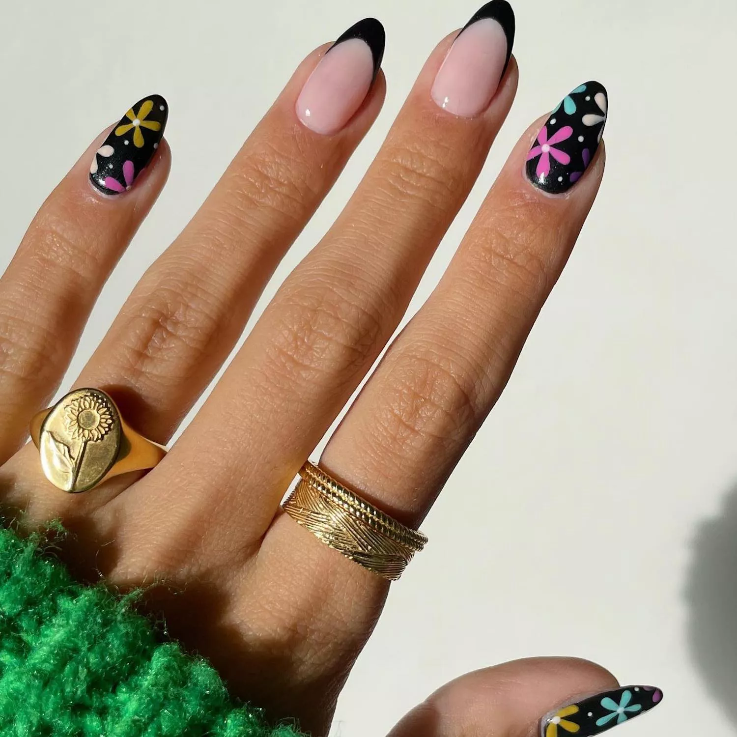 Black manicure with French tip accent nails and multicolored retro floral nail designs