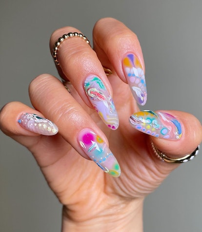 Creative paint-swatch nail art details are on-trend for 2024's Aquarius season.