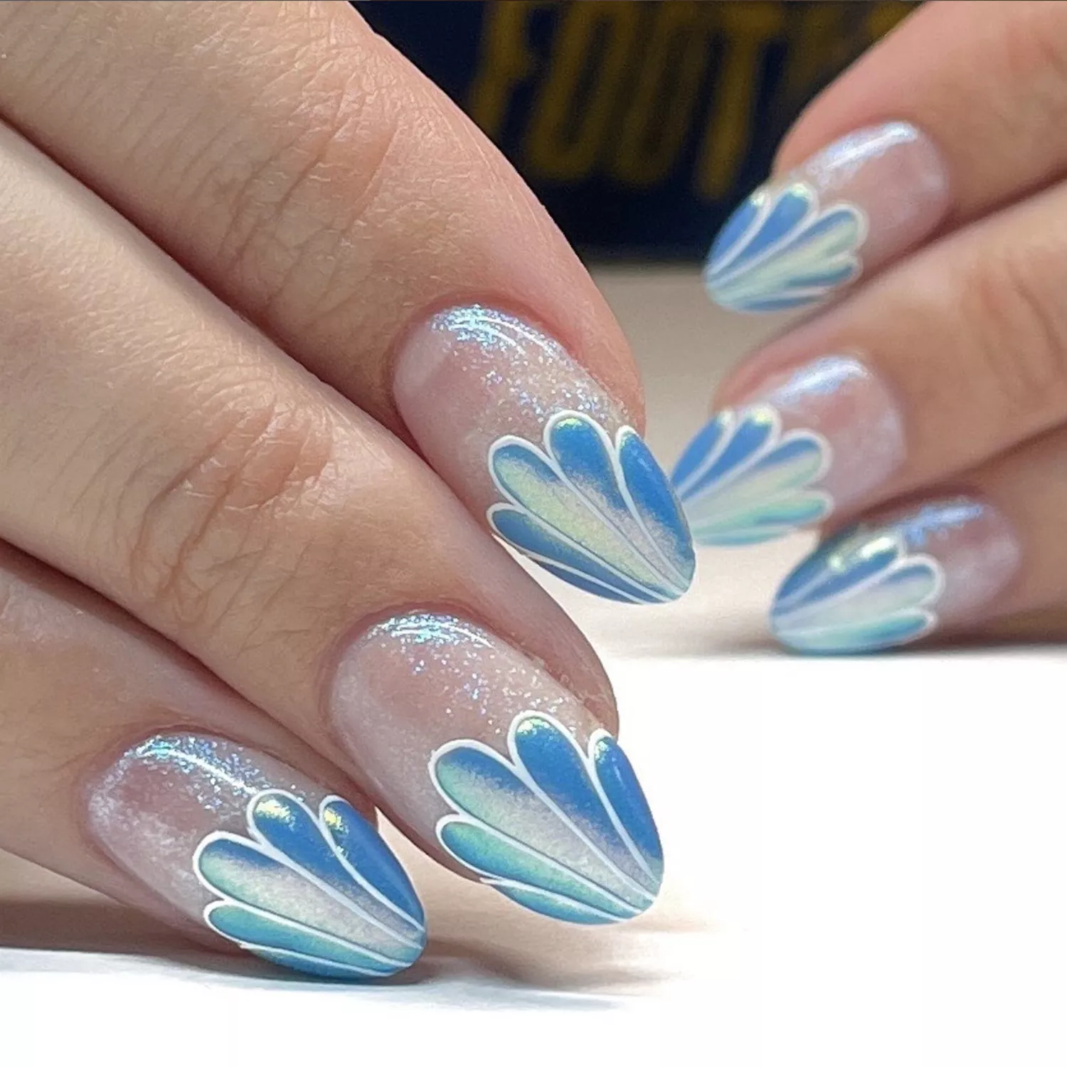 seashell nails in shimmery blue