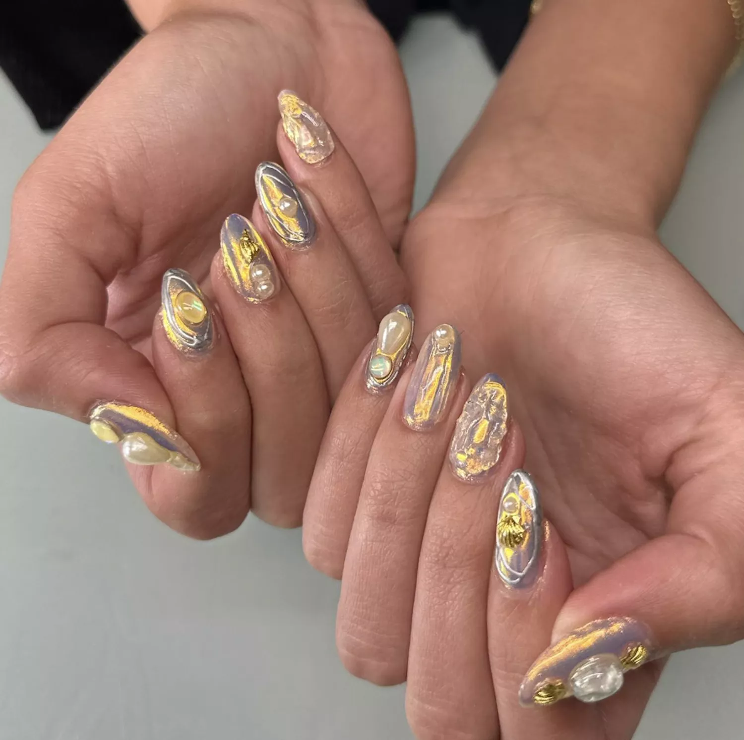 gold, pearls and shimmering nails