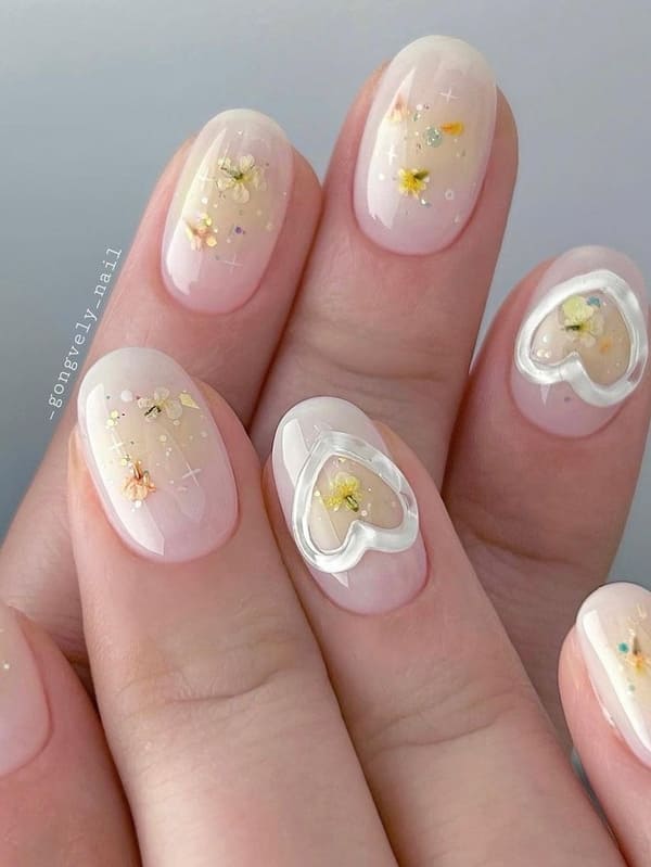 Korean blush nails with floral accents