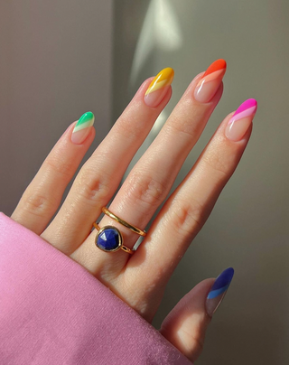 For a different take on a rainbow French manicure were loving this diagonal double line.