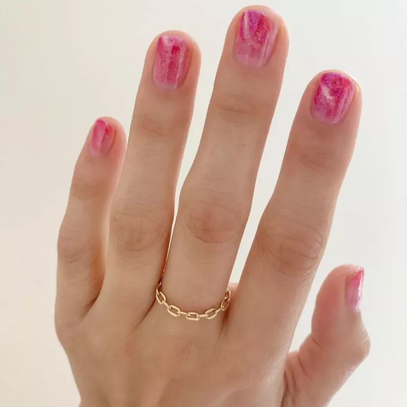 Pink glittery ombré nail design