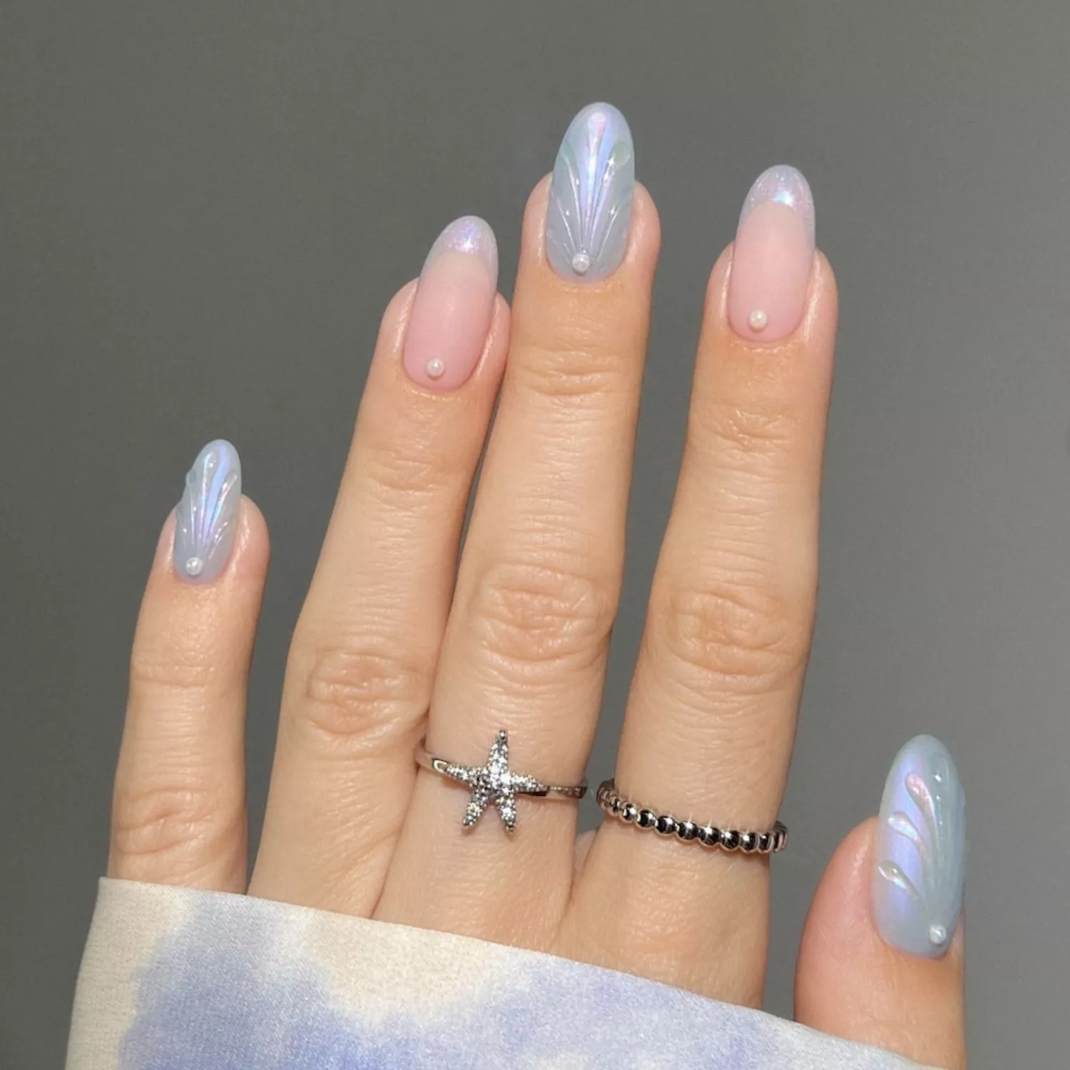 Periwinkle seashell mani with french mani accent nails