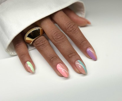 Colorful Skittle nail art is on-trend for 2024's Aquarius season.