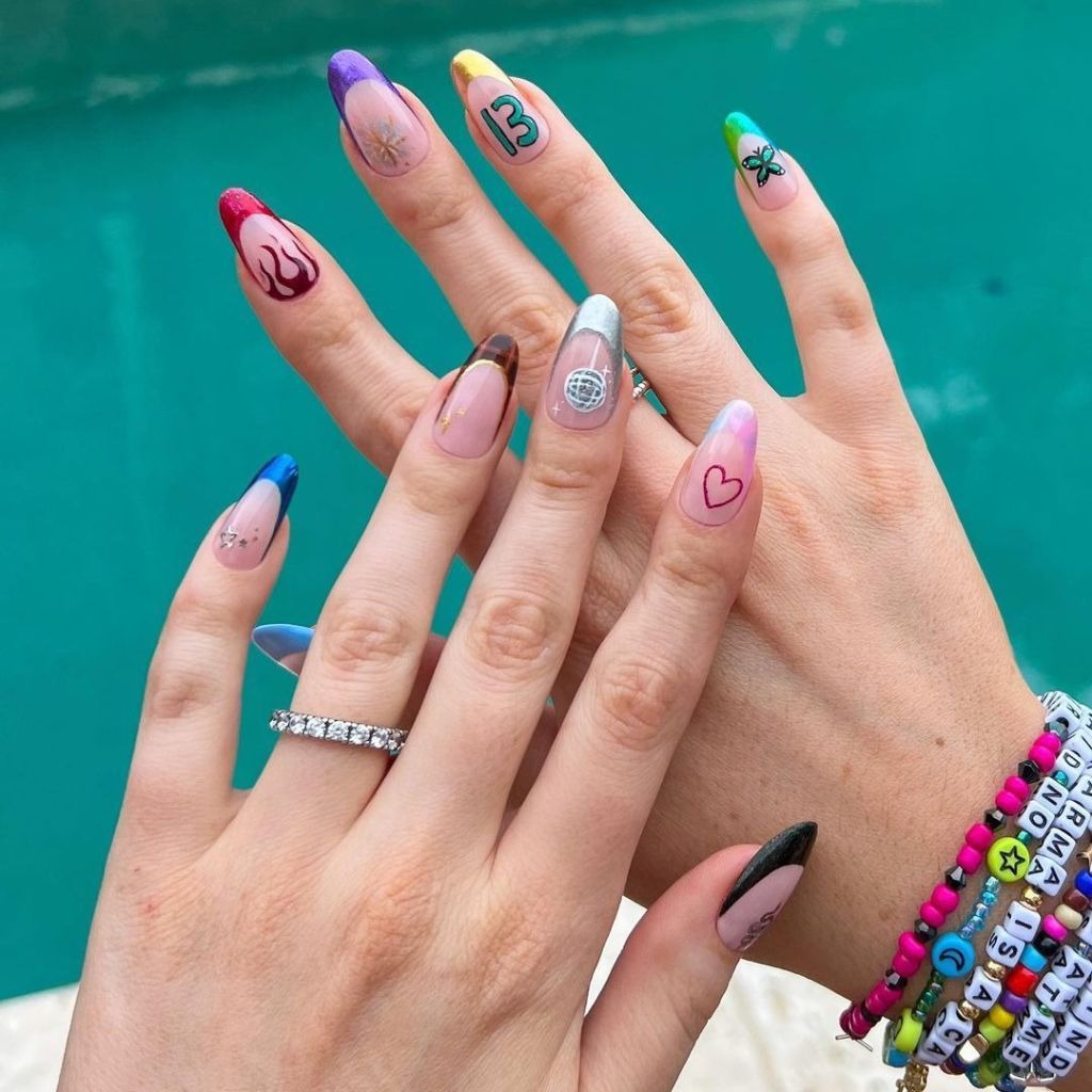 cute mismatched French manicure with nail art inspired by different albums