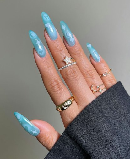 Aqua blue nails with airbrushed details are on-trend for 2024's Aquarius season.