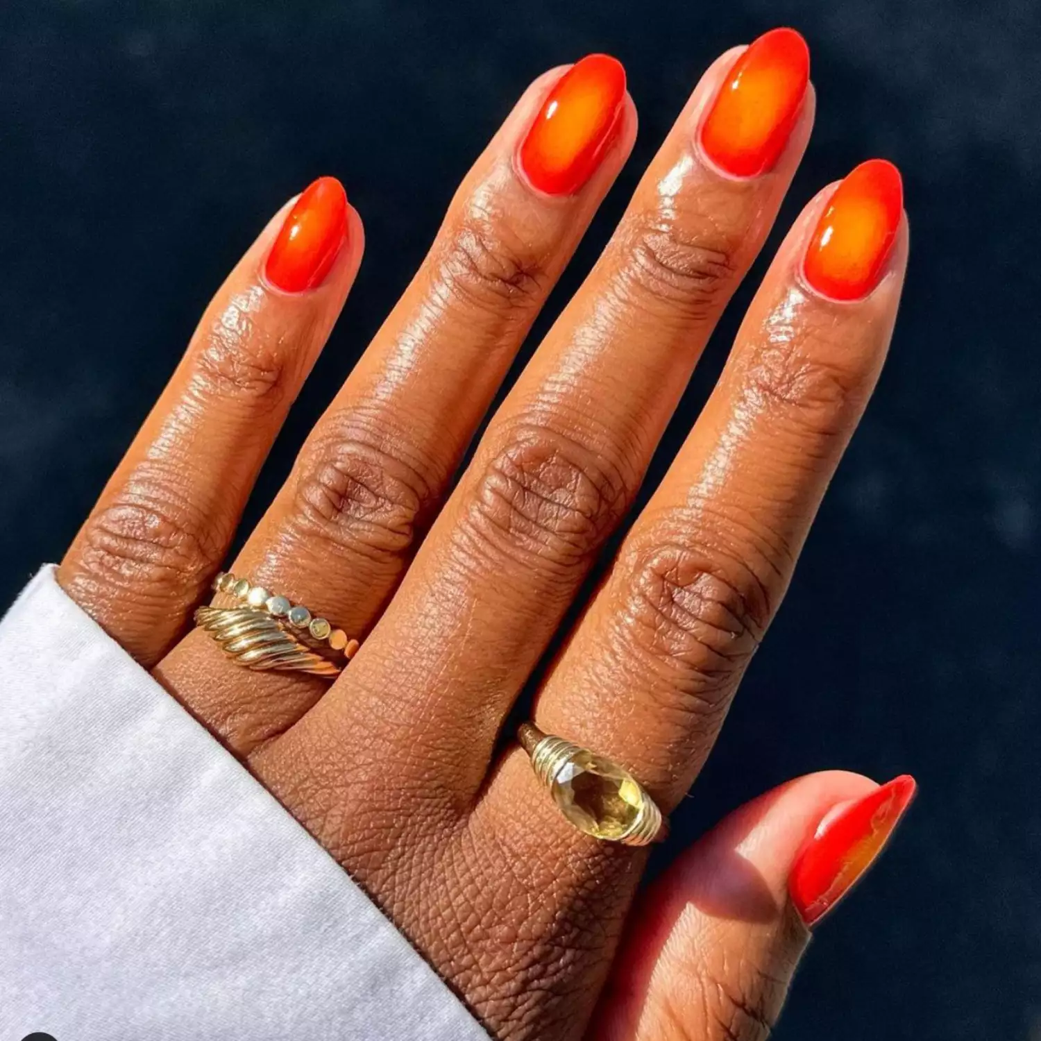 Orange-red aura nails.