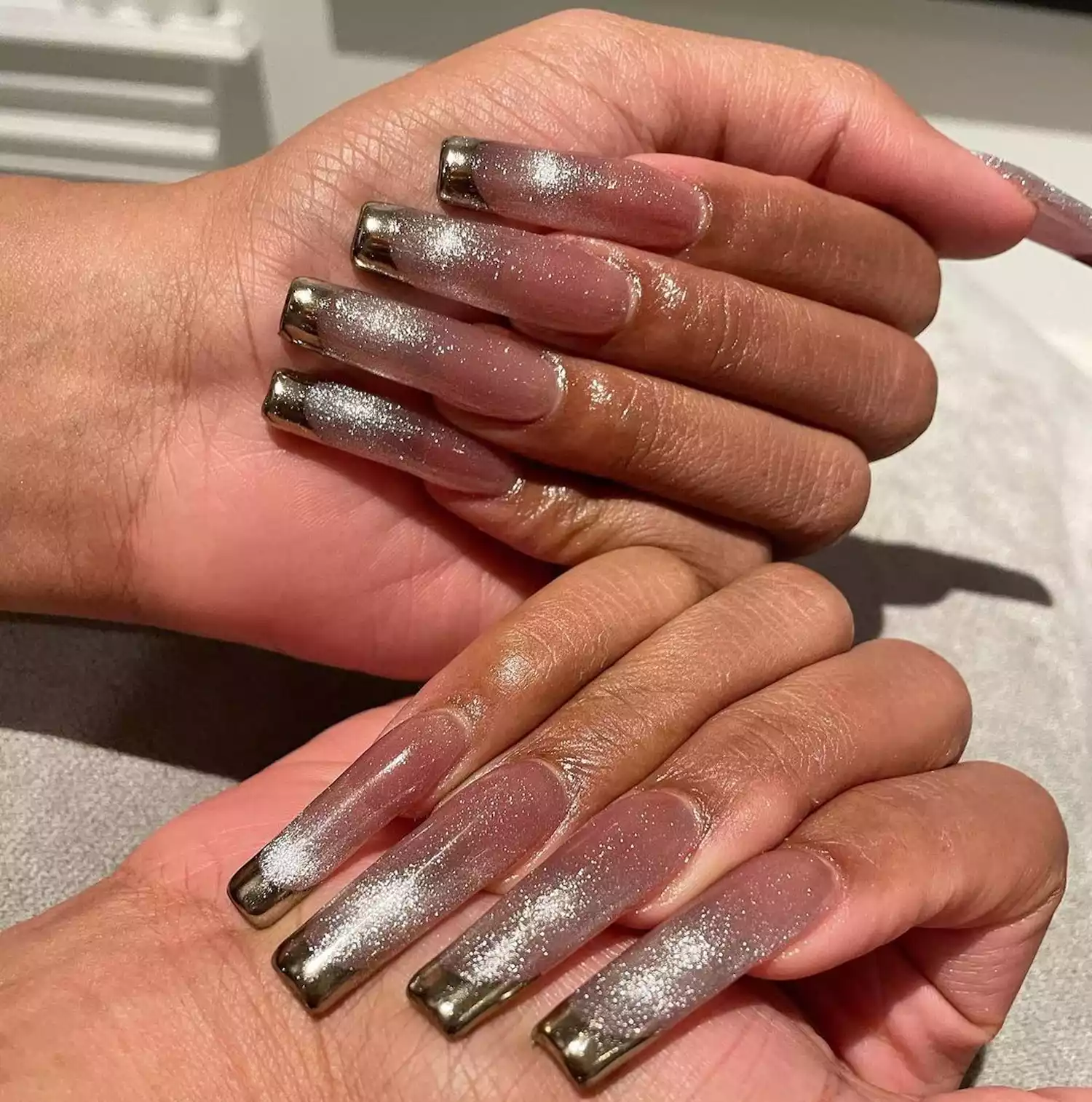 shimmery cat eye nails on megan the stallion