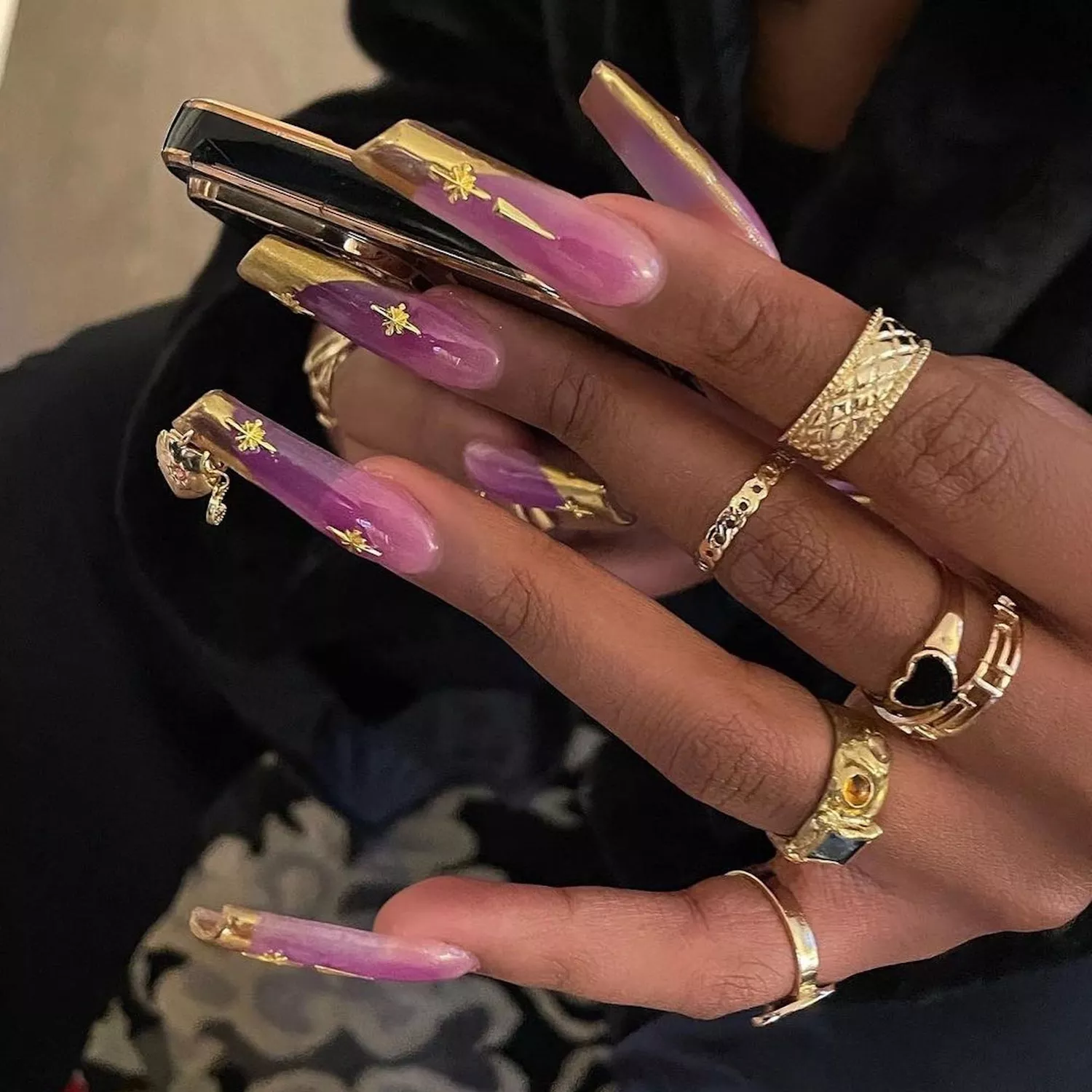 purple and gold french nails on megan thee stallion