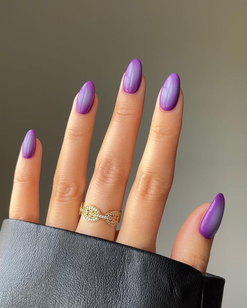 moody purple almond shaped aura nails