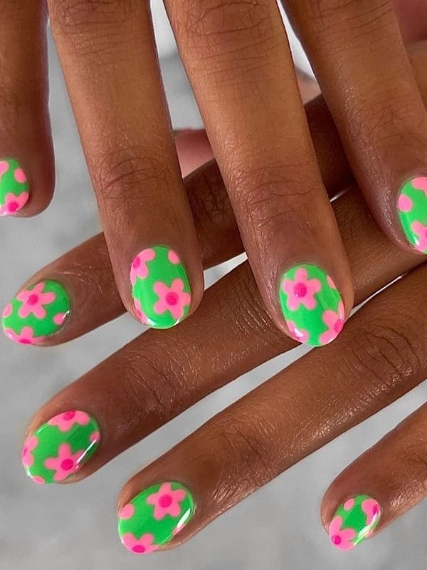 neon green and pink flower nails 