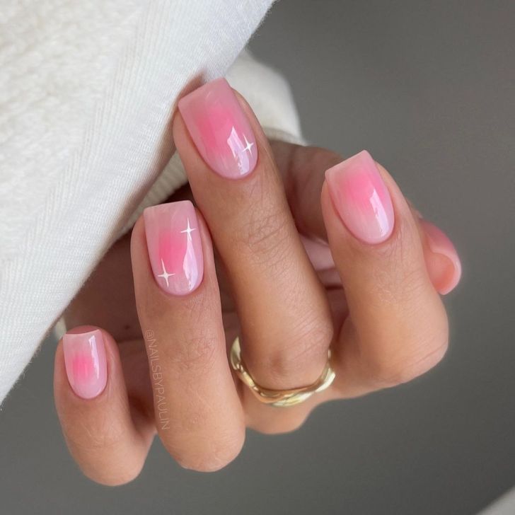 pink square shaped aura nails with a white celestial star design