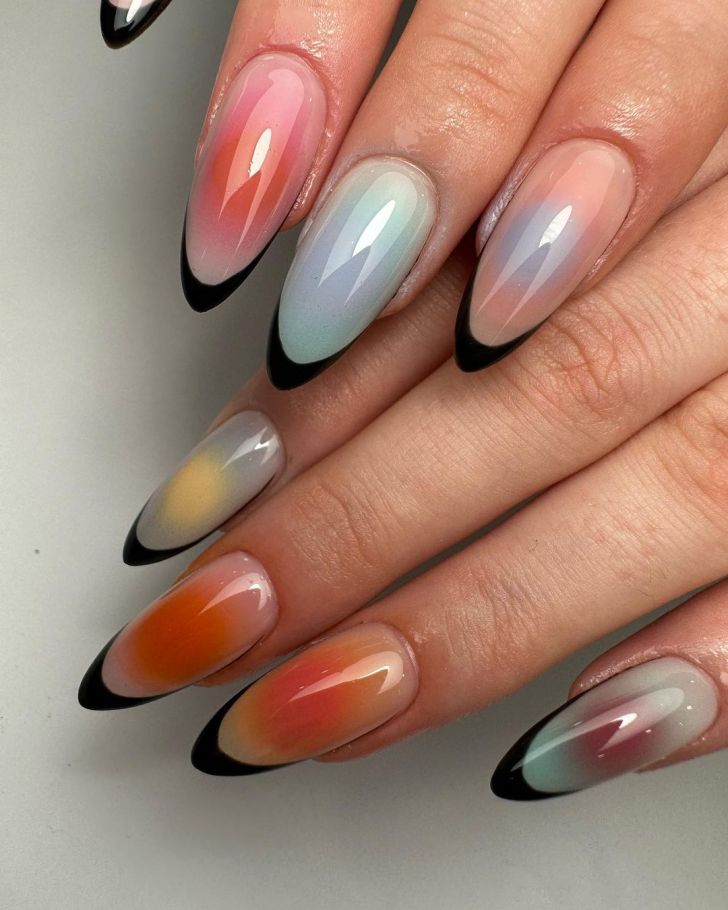 rainbow aura nails with a black French tip design