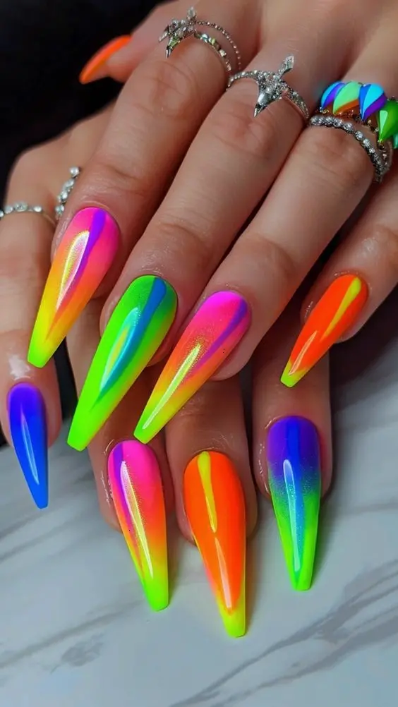 These long ballerina nails are adorned with a glowing neon effect, showcasing bright gradients that give the impression of neon rainbow. Ideal for night events or parties, these nails will glow under UV light, ensuring you grab attention.