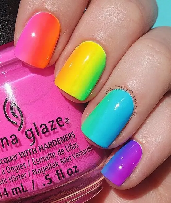 Bright and bold, these square nails showcase a smooth gradient transition between neon pink, yellow, green, blue, and purple. The design is perfect for those who appreciate a pop of color with a sleek, glossy finish.