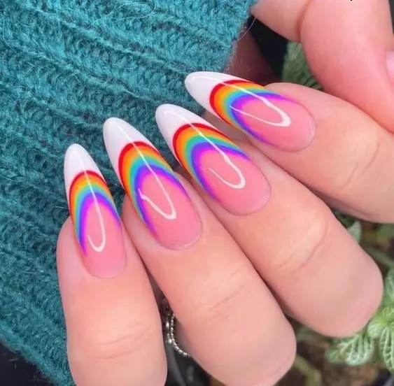 Sleek almond-shaped nails showcasing a minimalist neon rainbow arc on a transparent base. Each nail features a perfectly shaped rainbow that adds a subtle yet playful touch to a natural look.