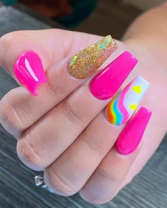 These playful ballerina nails combine hot pink with neon rainbow accents and glitter, making them perfect for those looking to make a bold statement. The design integrates sparkle and vivid colors, ideal for a fun night out or a special occasion.