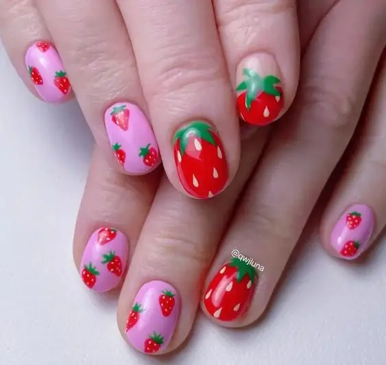 Vivid strawberry prints on a bright pink base give these oval nails a bold and cheerful look. The design is perfect for making a statement with a fun and fruity theme, suitable for all ages and occasions.