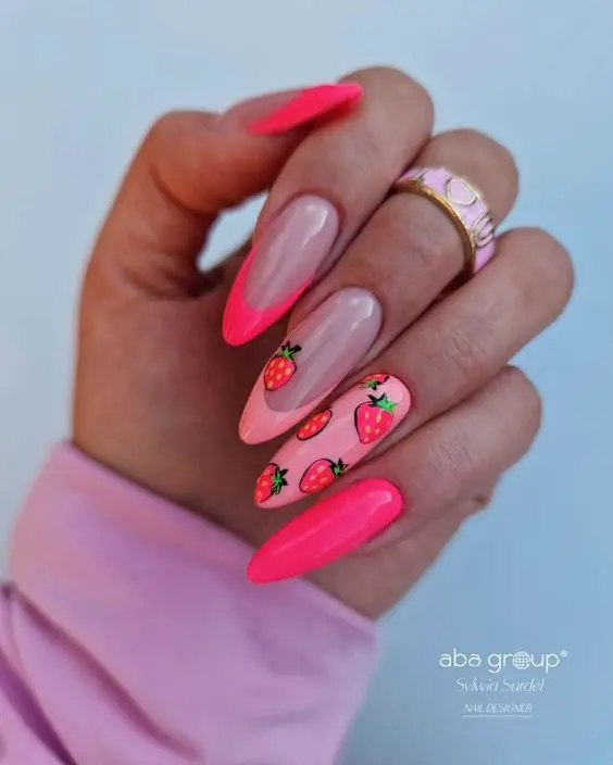 Vibrant summer strawberry nail art featuring bright orange and clear nails with playful strawberry designs, perfect for a fun and youthful look. This design blends bold colors with cute accents, ideal for seasonal trends.