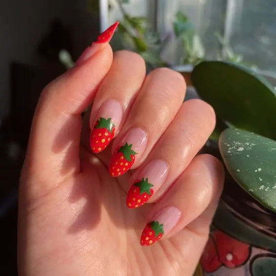 Subtle yet striking, these strawberry-themed nails offer a soft, light red base with delicate strawberry patterns. Ideal for those who prefer a more understated but playful manicure.