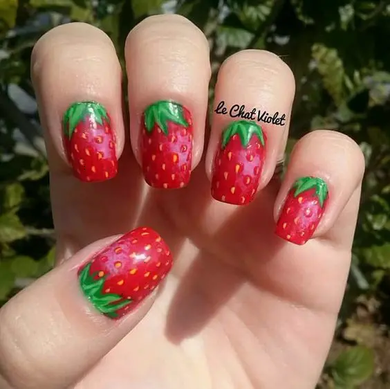 Bright red strawberries with a realistic finish on a green background make these nails eye-catching and vivid. This design is ideal for anyone who loves a naturalistic and vibrant look.