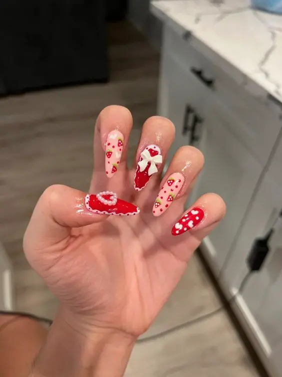 Bright red and translucent nails adorned with cute strawberry accents. Perfect for a playful summer look, these nails blend vibrant colors and subtle tones for a fresh and engaging style.